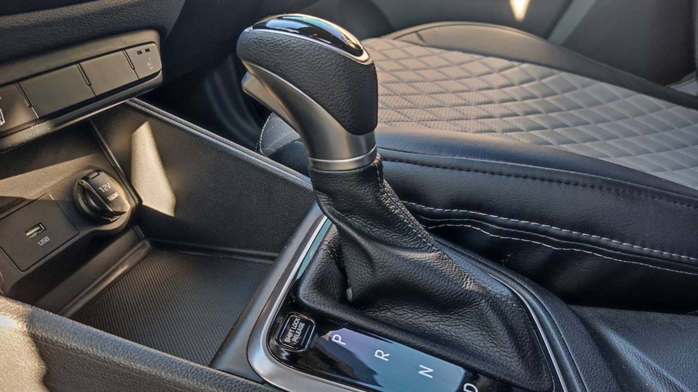 What happens if you shift into reverse while driving?